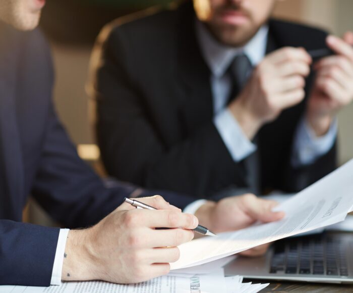 Successful Business Partners Discussing Contract